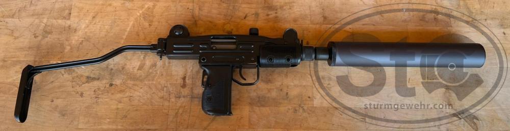 323 mini with suppressor.JPG